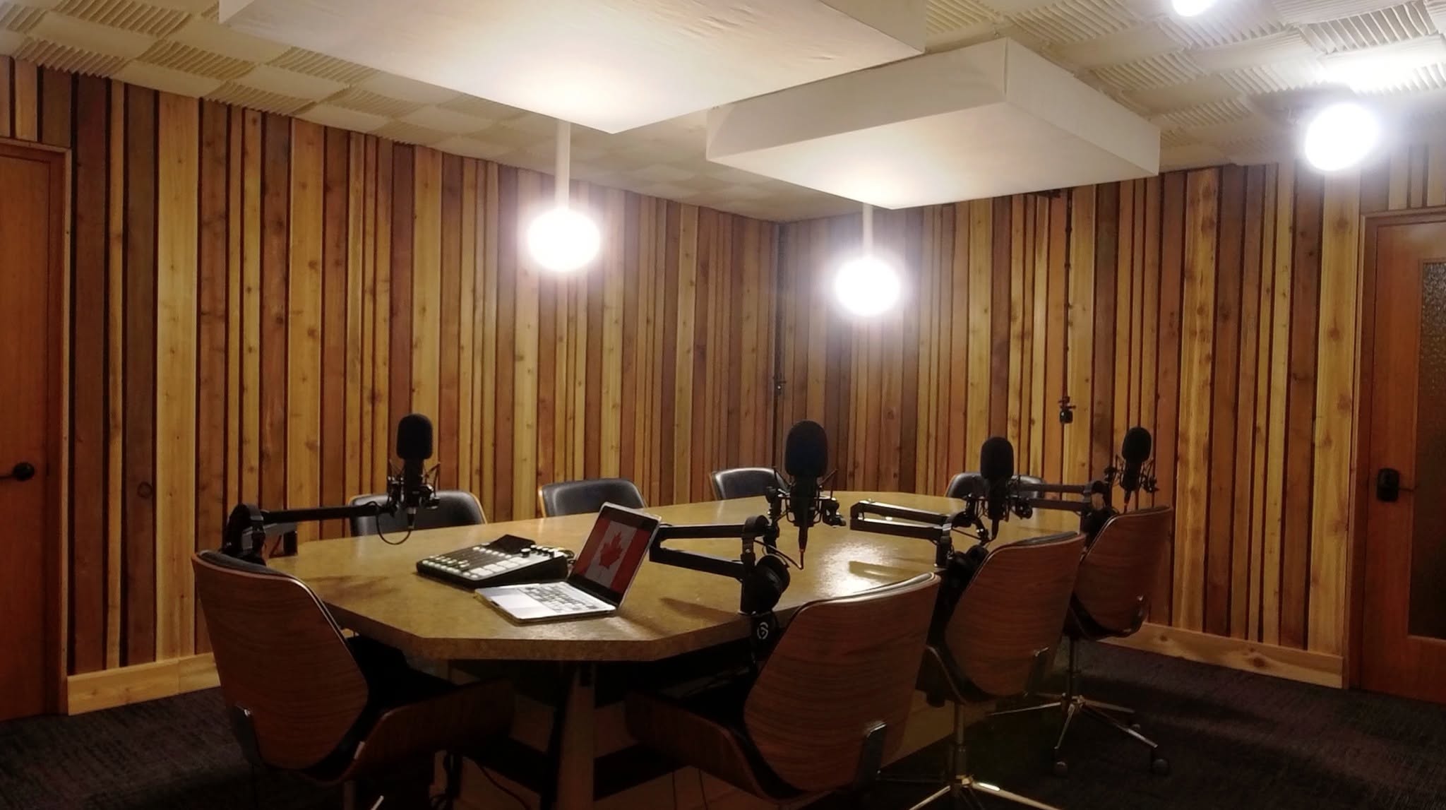 Cedarwood Studios recording table with microphones and mixing console